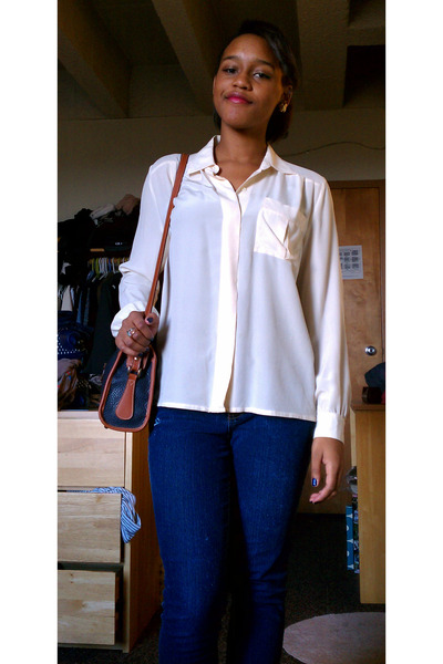 cream shirt and blue jeans