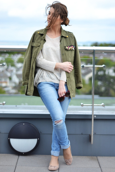 green jacket with blue jeans